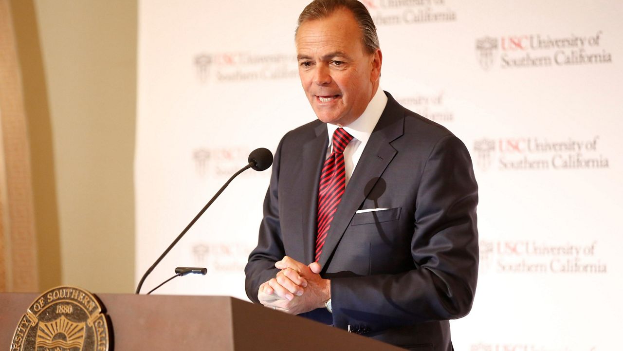 Rick Caruso, chairman of the University of Southern California Board of Trustees announces USC's 12th president in Los Angeles, March 20, 2019. (AP Photo/Damian Dovarganes, File)