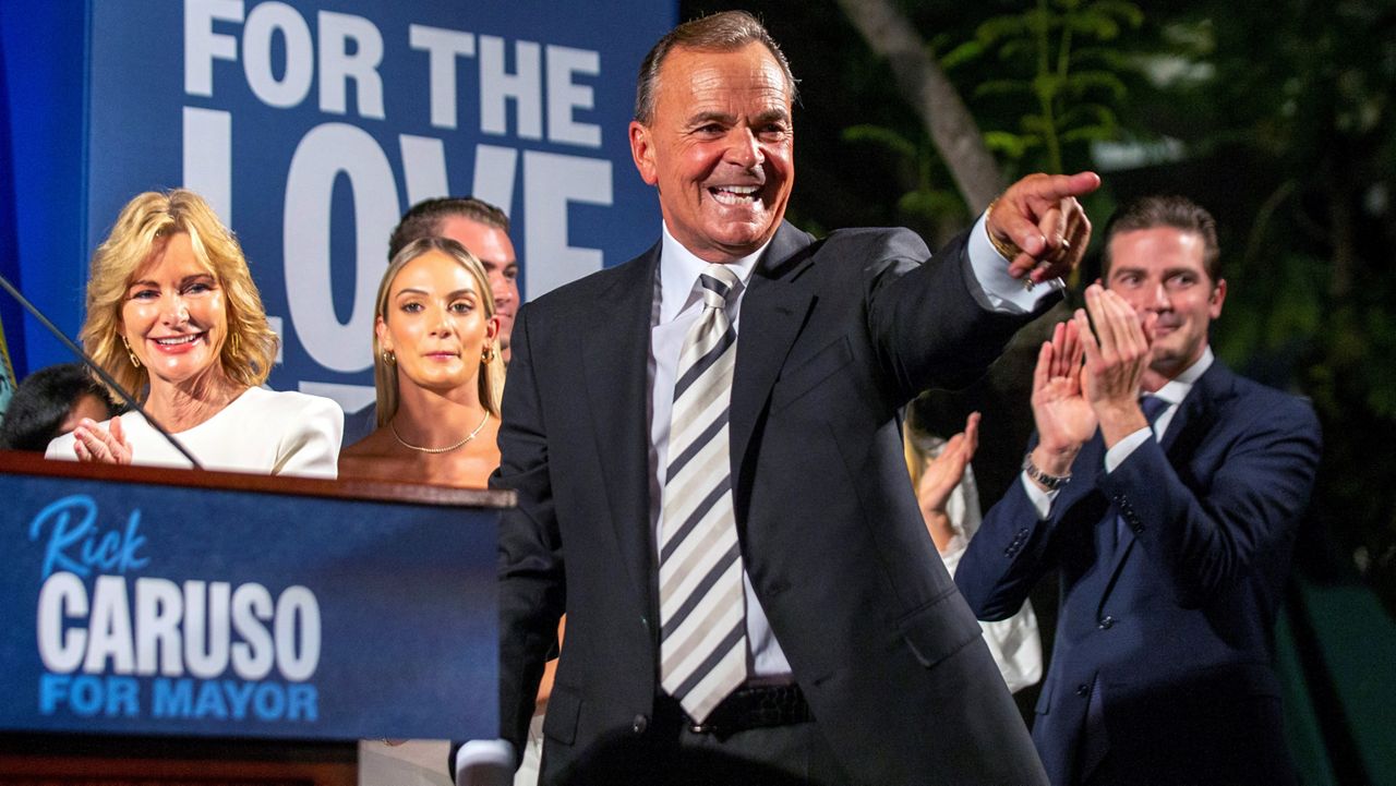 Rick Caruso, a Democratic candidate for Los Angeles mayor, celebrates at his primary-night gathering in LA, June 7, 2022, with his family behind him. (AP Photo/Alex Gallardo)