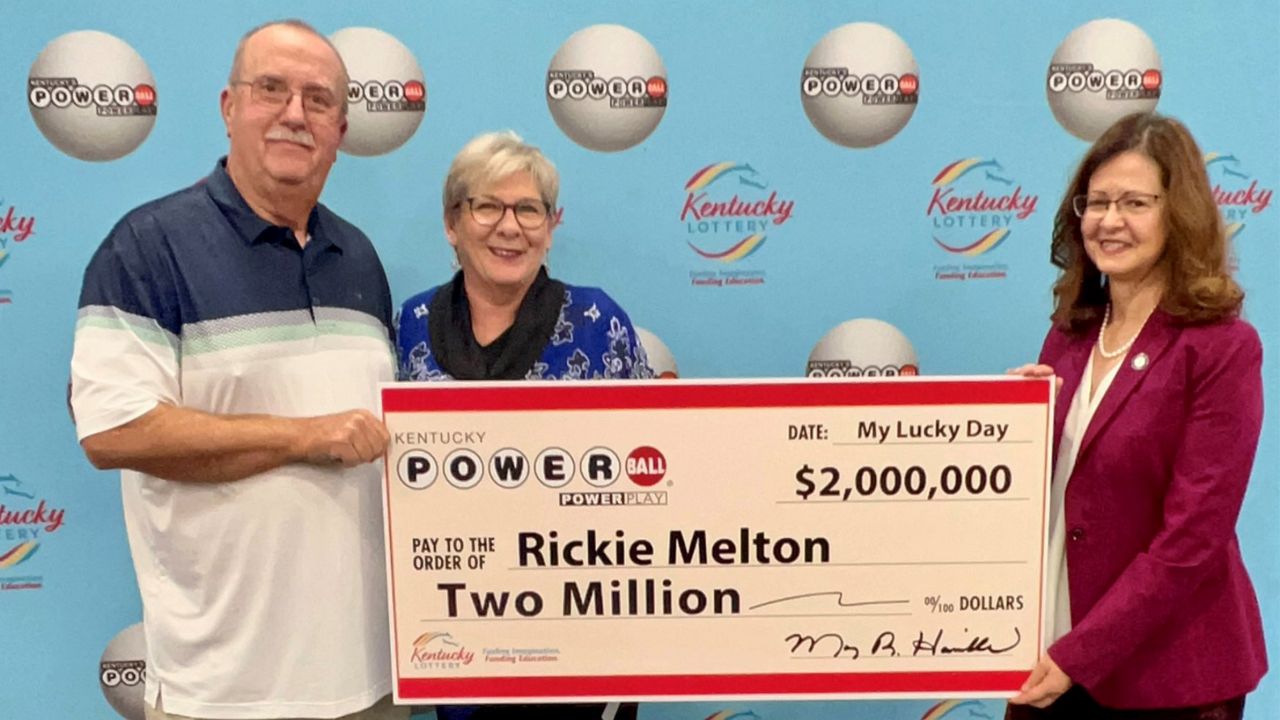 Rickie and Karen Melton of Symsonia, Kentucky won $2 million in the Powerball drawing Saturday, Nov. 5, 2022.  President of the Kentucky Lottery, Mary Harville presented them with their check (Kentucky Lottery)