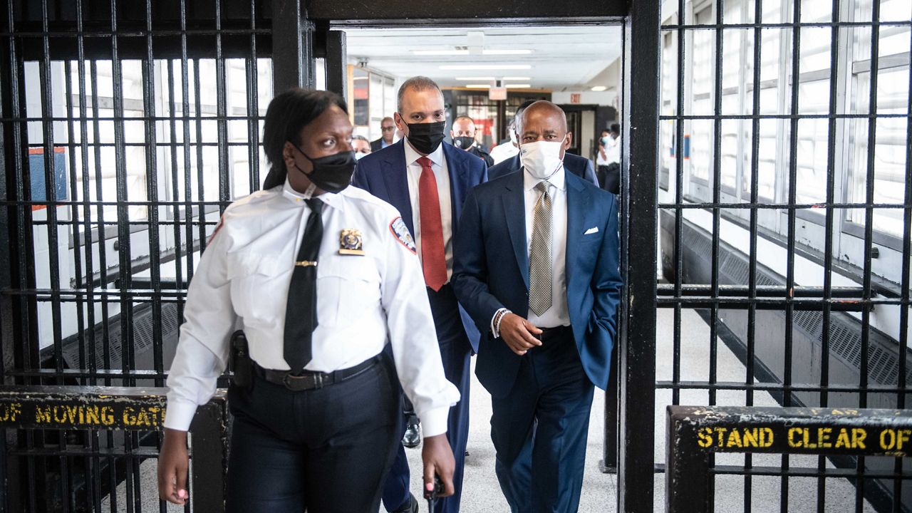 Mayor Eric Adams (right) and Department of Correction Commissioner Louis Molina (center) tour Rikers Island on July 7, 2022. Ahead of a hearing in front of a federal judge Thursday, a group of councilmembers are calling for Rikers Island to be taken from city control and placed under a federal receivership. (Mayoral Photography Office/Michael Appleton)