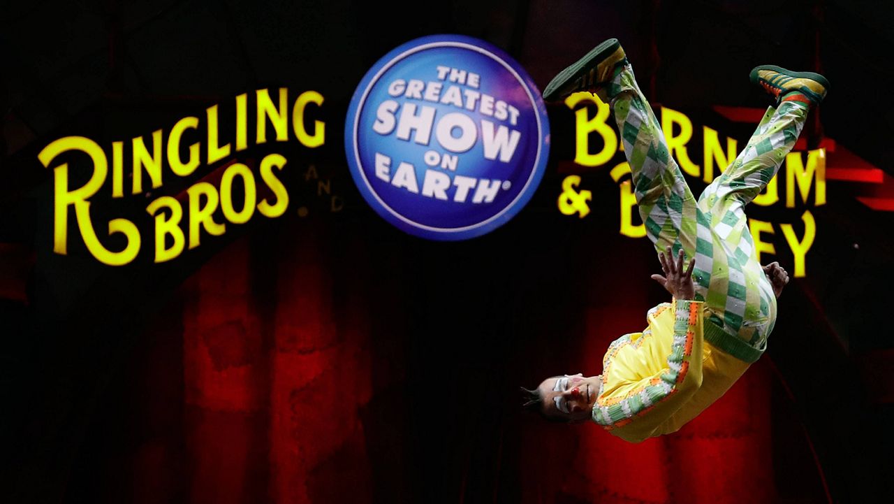A Ringling Bros. and Barnum & Bailey clown does a somersault during a performance in Orlando, Fla. (AP Photo/Chris O'Meara, File)