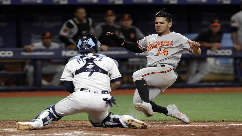 Tampa Bay Rays catcher Michael Perez (7) prepares to tag out Baltimore Orioles' Rio Ruiz (14) as he tried to score on an RBI double by Joey Rickard off relief pitcher Diego Castillo during the 11th inning of a baseball game Thursday, April 18, 2019, in St. Petersburg, Fla. (AP Photo/Chris O'Meara)