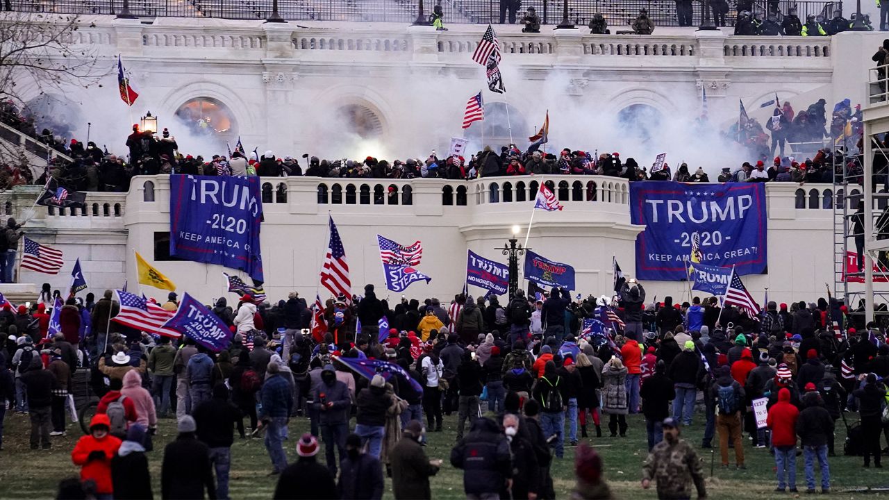  In this Wednesday, Jan. 6, 2021, file photo, violent protesters, loyal to President Donald Trump, storm the Capitol, in Washington. (AP Photo/John Minchillo, File)