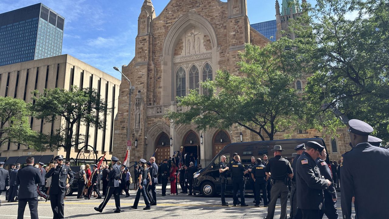 Officers outside the memorial service for fallen Cleveland Police Officer Jamieson Ritter.