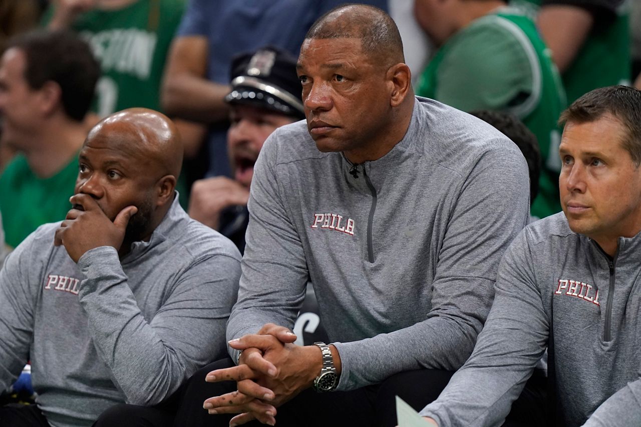 Philadelphia 76ers head coach Doc Rivers, center, watches from the bench as the 76ers trail the Boston Celtics during the second half of Game 7 in the NBA basketball Eastern Conference semifinal playoff series, Sunday, May 14, 2023, in Boston. (AP Photo/Steven Senne)