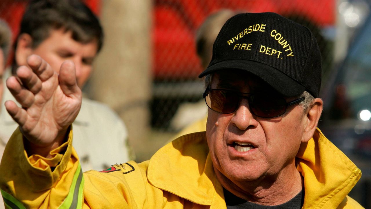 Capt. John Hawkins of the Riverside County fire Dept. talks about the Esperanza Fire during a news conference in Beaumont, Calif., Oct. 26, 2006. (AP Photo/Chris Carlson)
