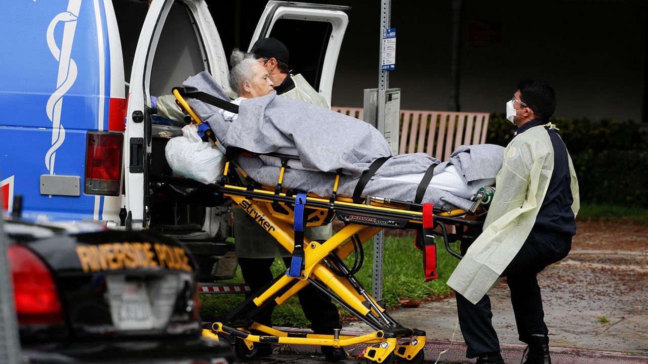 A patient is evacuated from the Magnolia Rehabilitation and Nursing Center in Riverside, Calif., Wednesday, April 8, 2020. More than 80 patients from a Riverside skilled nursing facility are being evacuated this morning to other healthcare locations throughout Riverside County, Calif. (AP Photo/Chris Carlson)