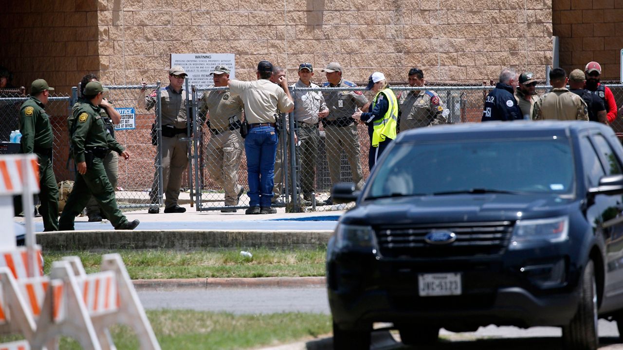 Law enforcement, and other first responders, gather outside Robb Elementary School following a shooting, May 24, 2022, in Uvalde, Texas. (AP Photo/Dario Lopez-Mills, File)