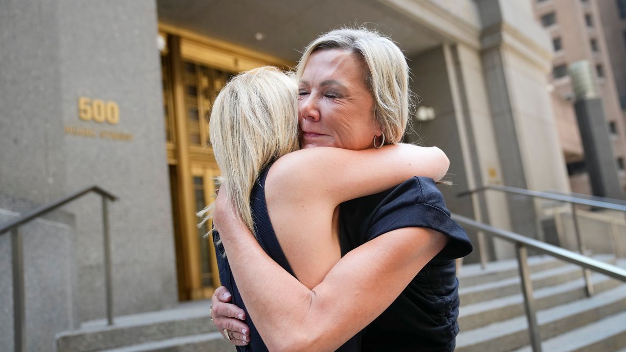 Sexual assault survivors Amy Yoney and Laurie Kanyok embrace after speaking to members of the media during a break in sentencing proceedings for convicted sex offender Robert Hadden outside court on Monday, July 24, 2023 in New York.