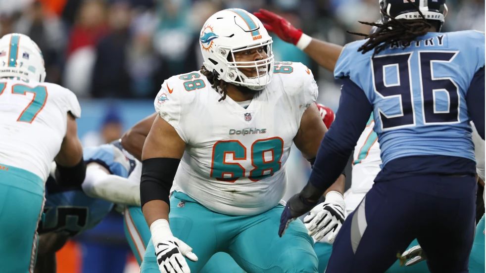 Miami Dolphins guard Robert Hunt plays against Tennessee Titans defensive end Denico Autry (96) in the second half of an NFL football game, Jan. 2, 2022, in Nashville, Tenn. The Carolina Panthers have agreed to terms on a five-year, $100 million contract with free agent guard Hunt that includes $63 million in guaranteed money, two people familiar with the situation told The Associated Press on Monday, March 11, 2024. (AP Photo/Wade Payne, File)