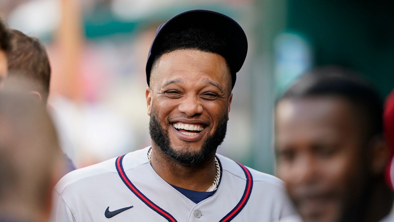 Robinson Canó walks in the dugout before a baseball game on July 15, 2022 in Washington.