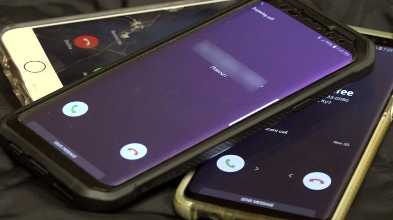 Robocalls are received, while phones are piled up onto one another. (Spectrum News 1)