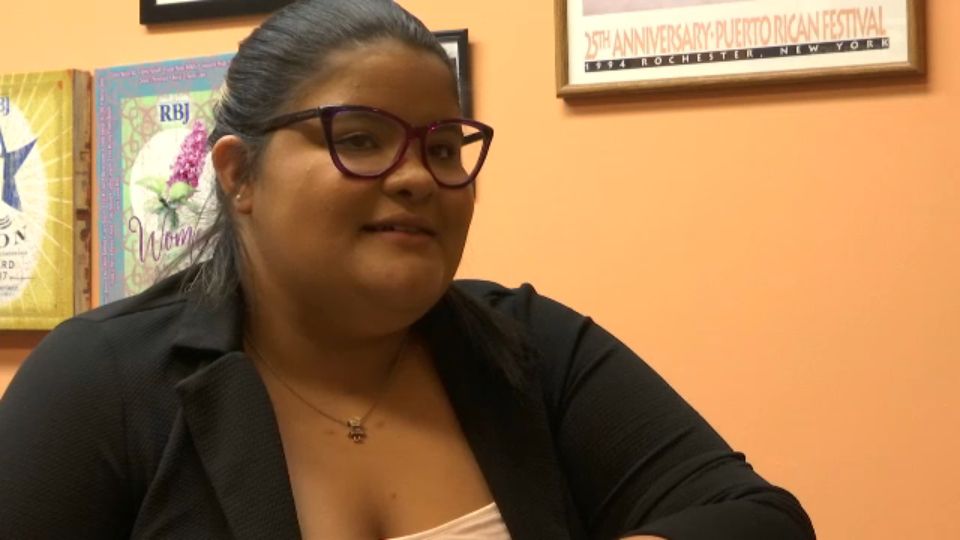 Coralys Quinones, a Hurricane Maria resettler from Puerto Rico, busily files papers in an office at Ibero American Action League headquarters. Jobs and housing remain the biggest needs for resettlers, one year after the storm struck.