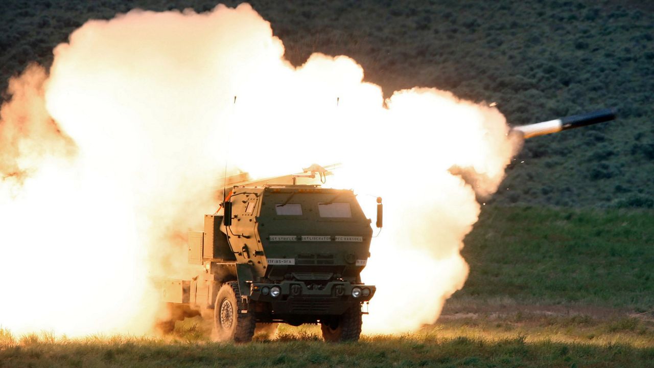 A launch truck fires the High Mobility Artillery Rocket System (HIMARS) produced by Lockheed Martin during combat training in the high desert of the Yakima Training Center in Washington on May 23, 2011. (Tony Overman/The Olympian via AP, File)