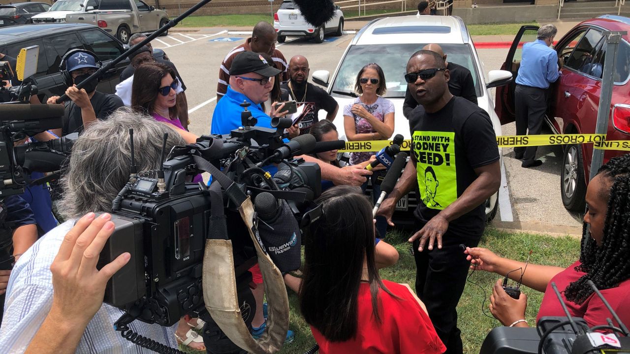 Death row inmate Rodney Reed's brother, Roderick Reed, speaks with reporters during a hearing break in this image from July 19, 2021. (Spectrum News 1/Ed Keiner)