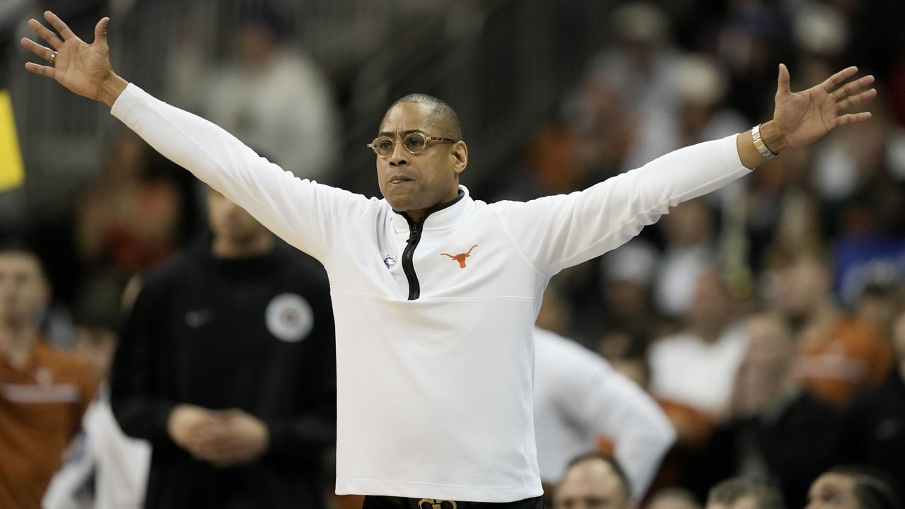 Texas head coach Rodney Terry reacts in the second half of an Elite 8 college basketball game against Miami in the Midwest Regional of the NCAA Tournament Sunday, March 26, 2023, in Kansas City, Mo. (AP Photo/Charlie Riedel)