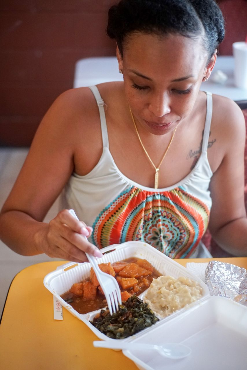 A woman enjoying her meal.