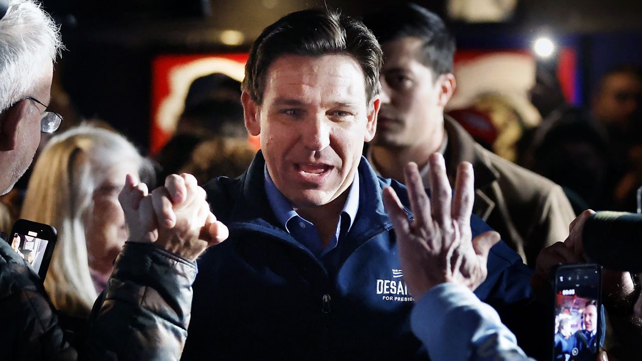 Republican presidential candidate and Florida Gov. Ron DeSantis arrives for a campaign event at Wally's bar, Wednesday, Jan. 17, 2024, in Hampton, N.H. (AP Photo/Michael Dwyer)