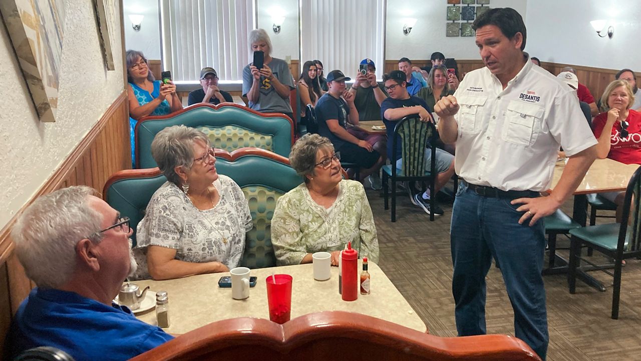Ron DeSantis talks with diners at Vinton Family Restaurant in Vinton, Iowa on Saturday, Aug. 5, 2023.