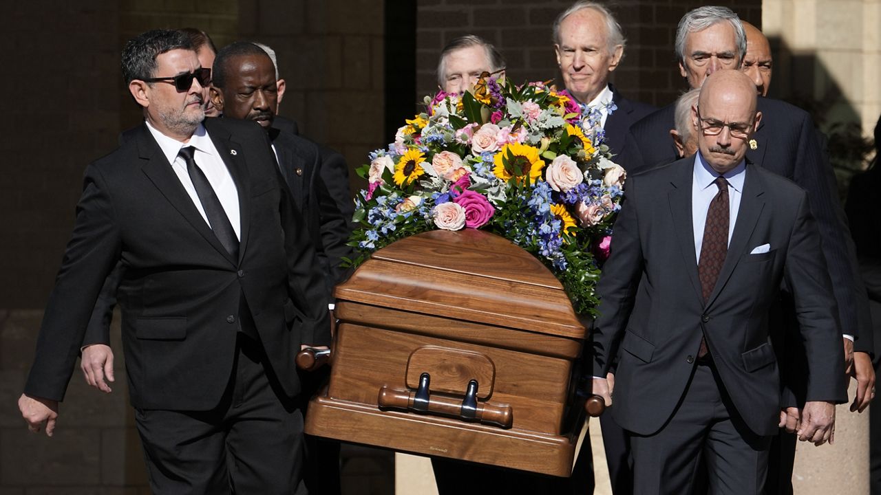 Former and current U.S. Secret Service agents carry casket of former first lady Rosalynn Carter at Phoebe Sumter Medical Center in Americus, Ga., Monday, Nov. 27, 2023. (AP Photo/Alex Brandon, Pool)