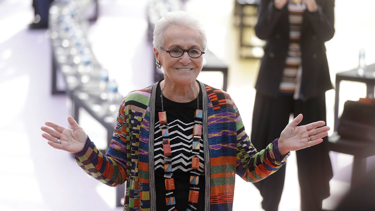 Rosita Missoni poses for photographers before the Missoni women's Spring/Summer 2018/19 fashion collection, presented in Milan, Italy, Sept. 23, 2017. (AP Photo/Luca Bruno, File)