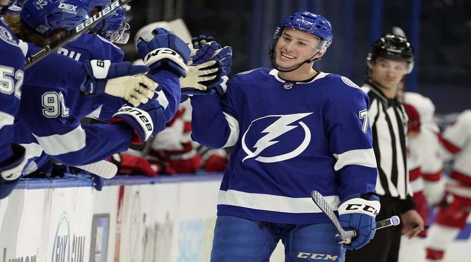 Tampa Bay Lightning forward Ross Colton (79) celebrates with the bench after his goal against the Carolina Hurricanes during the first period of an NHL hockey game Wednesday, Feb. 24, 2021, in Tampa, Fla. (AP Photo/Chris O'Meara)