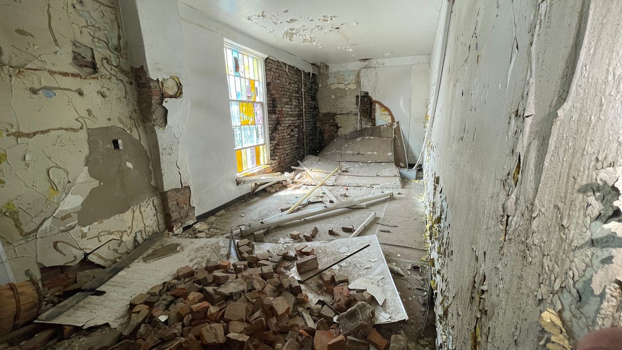 Inside Quinn Chapel years of damage are in need of repair before a new occupant can move in (Spectrum News 1/Mason Brighton)