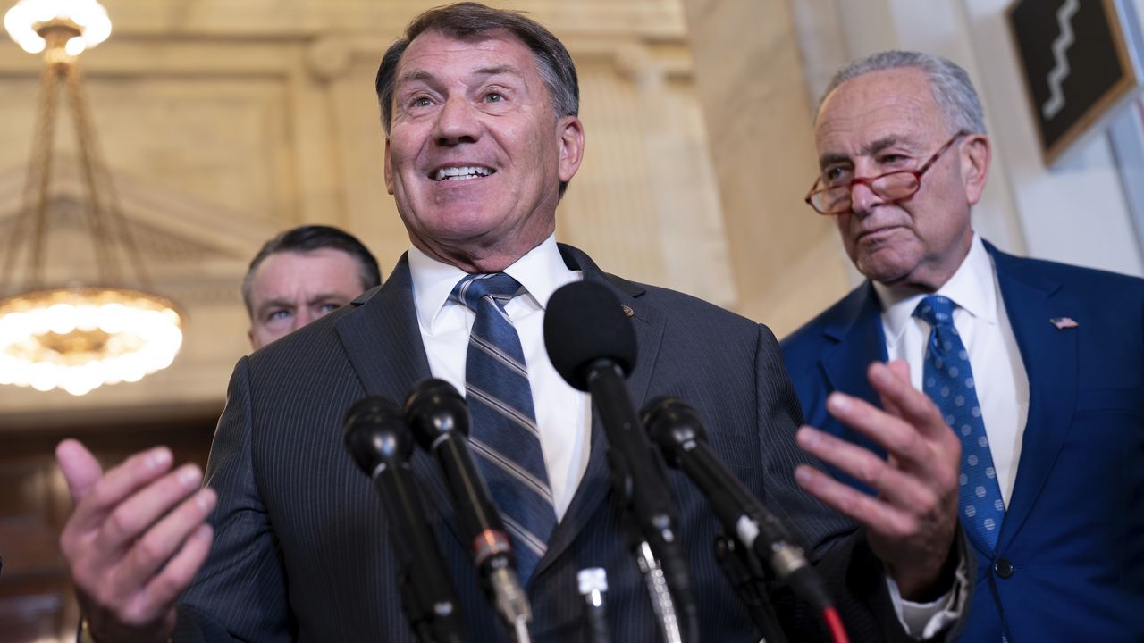 Sen. Mike Rounds, R-S.D., with Senate Majority Leader Chuck Schumer, D, N.Y., right, speaks to reporters at the Capitol in Washington, Sept. 13, 2023. (AP Photo/J. Scott Applewhite, File)