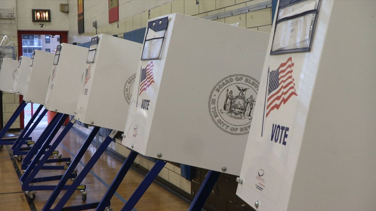 a line of white voting booths