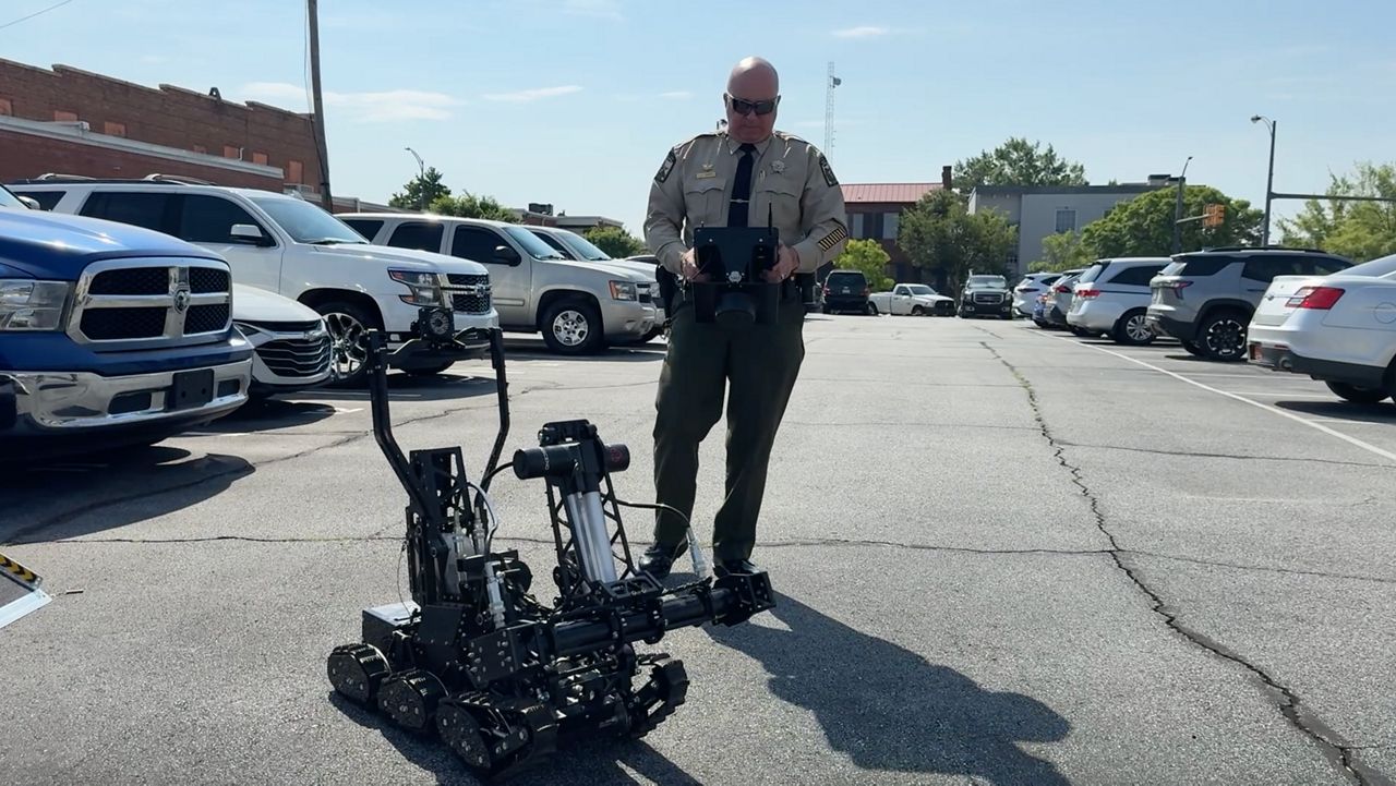 Chief Deputy Jason Owens demonstrates how to use the Vantage Breacher Robot