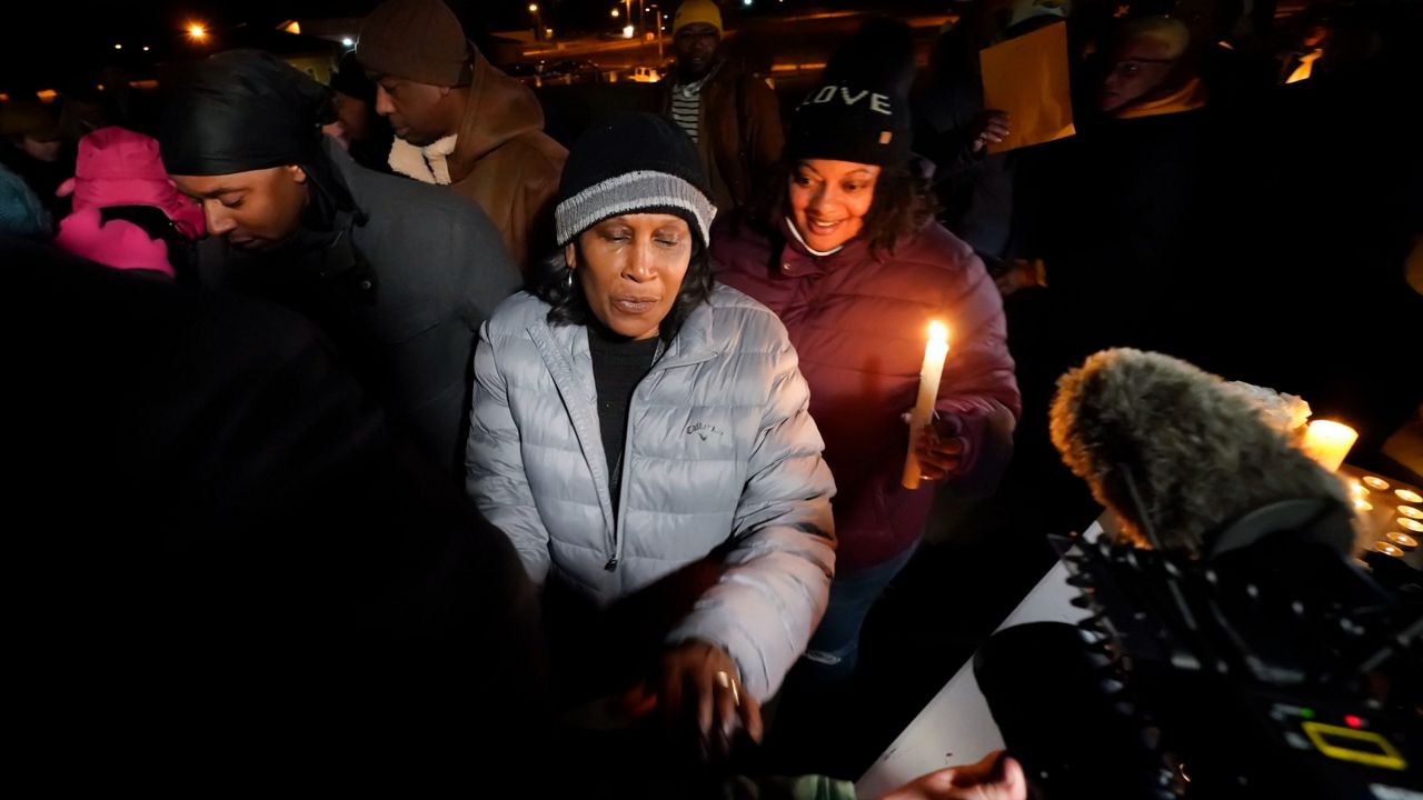 RowVaughn Wells, mother of Tyre Nichols, leaves at the conclusion of a candlelight vigil for her son Thursday night in Memphis, Tenn. (AP Photo/Gerald Herbert)