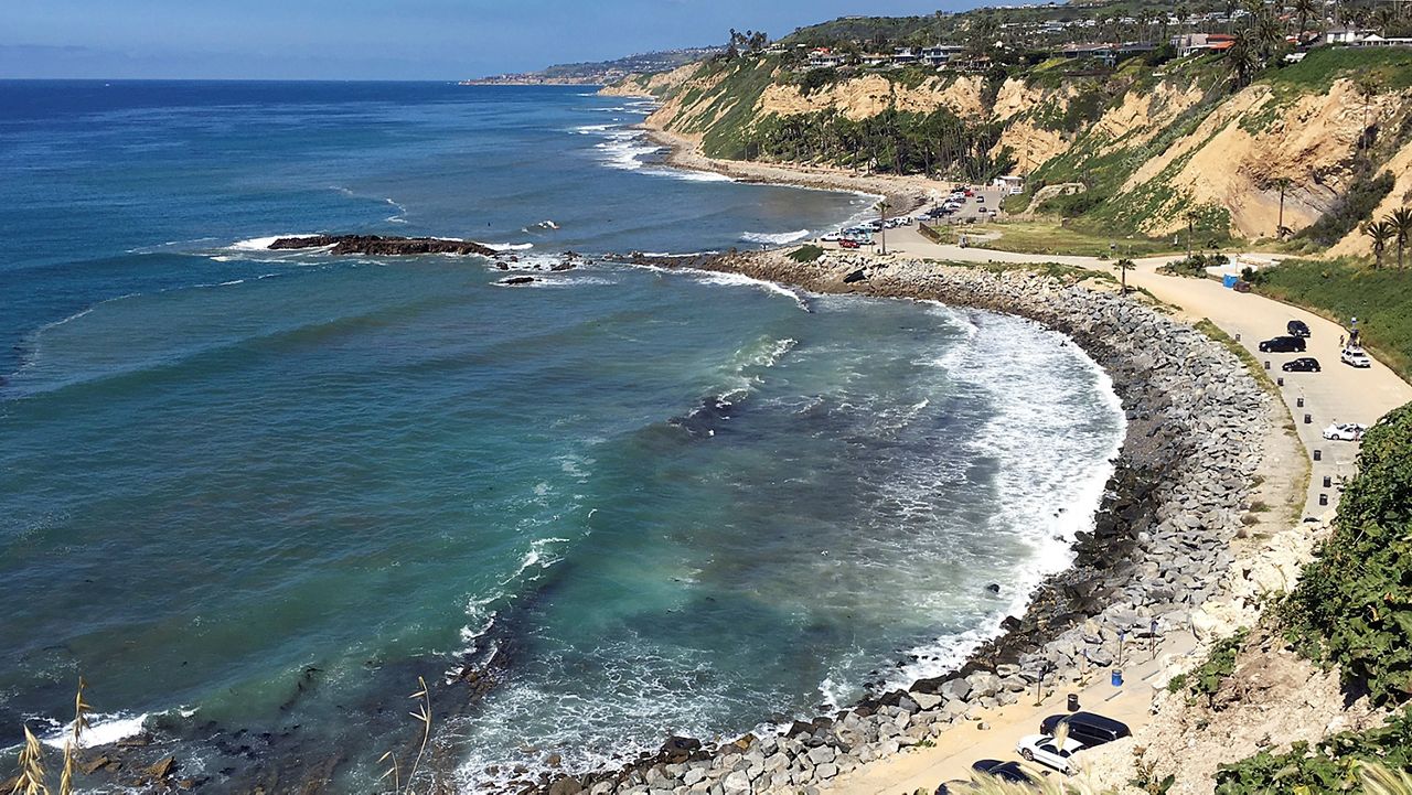 In this Sunday, March 26, 2017, photo, Royal Palms Beach in the San Pedro area of Los Angeles is protected by boulders placed there to forestall erosion. A new study predicts that with limited human intervention, 31 percent to 67 percent of Southern California beaches could completely erode back to coastal infrastructure or sea cliffs by the year 2100, with sea-level rises of 3.3 feet (1 meter) to 6.5 feet (2 meters). The study released Monday, March 27, 2017, used a new computer model to predict shoreline effects caused by sea level rise and changes in storm patterns due to climate change. (AP Photo/John Antczak)