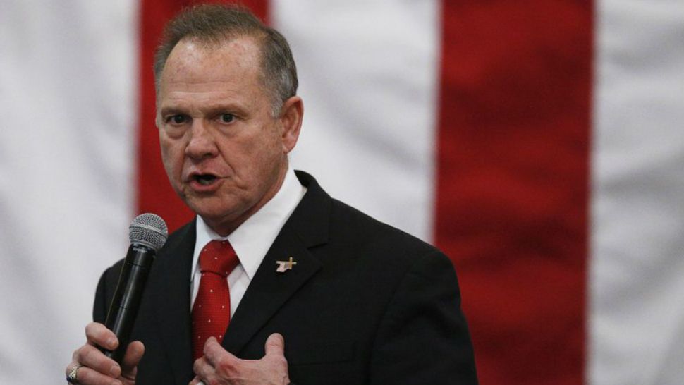 In this Dec. 11, 2017 file photo, U.S. Senate candidate Roy Moore speaks at a campaign rally in Midland City, Ala. Moore is going to court to try to stop Alabama from certifying Democrat Doug Jones as the winner of the U.S. Senate race. Moore filed a lawsuit Wednesday evening, Dec. 27, 2017. (AP Photo/Brynn Anderson)