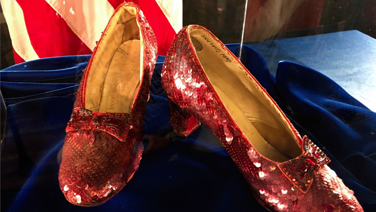 Ruby slippers once worn by Judy Garland in the "The Wizard of Oz" are displayed at a news conference on Sept. 4, 2018, at the FBI office in Brooklyn Center, Minn. (AP Photo/Jeff Baenen, File)