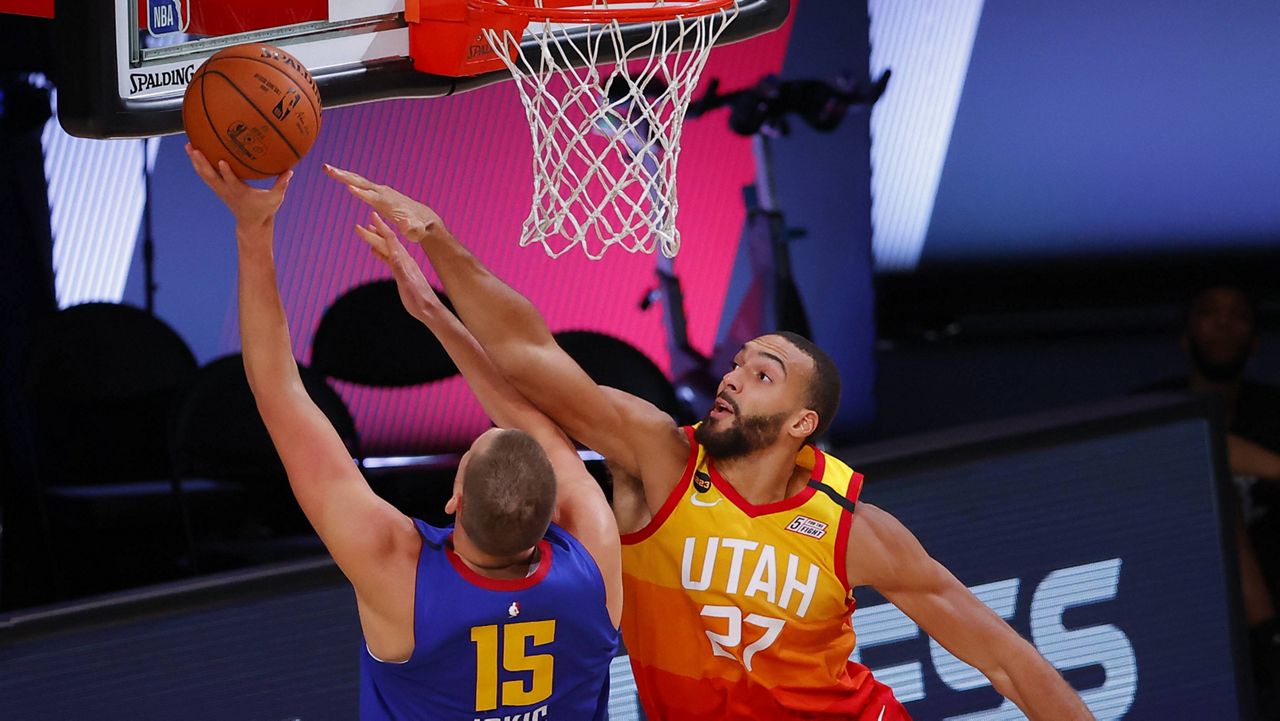 The Utah Jazz's Rudy Gobert (27) was the first NBA player to test positive for COVID-19 last year, although it's unlikely he was among the players still testing positive when the season resumed in July. (Kevin C. Cox/Pool Photo via AP, File)