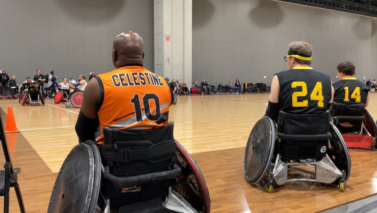 Davis Celestine watches a rugby match from the sidelines. (Spectrum  News 1/Josh Conner)