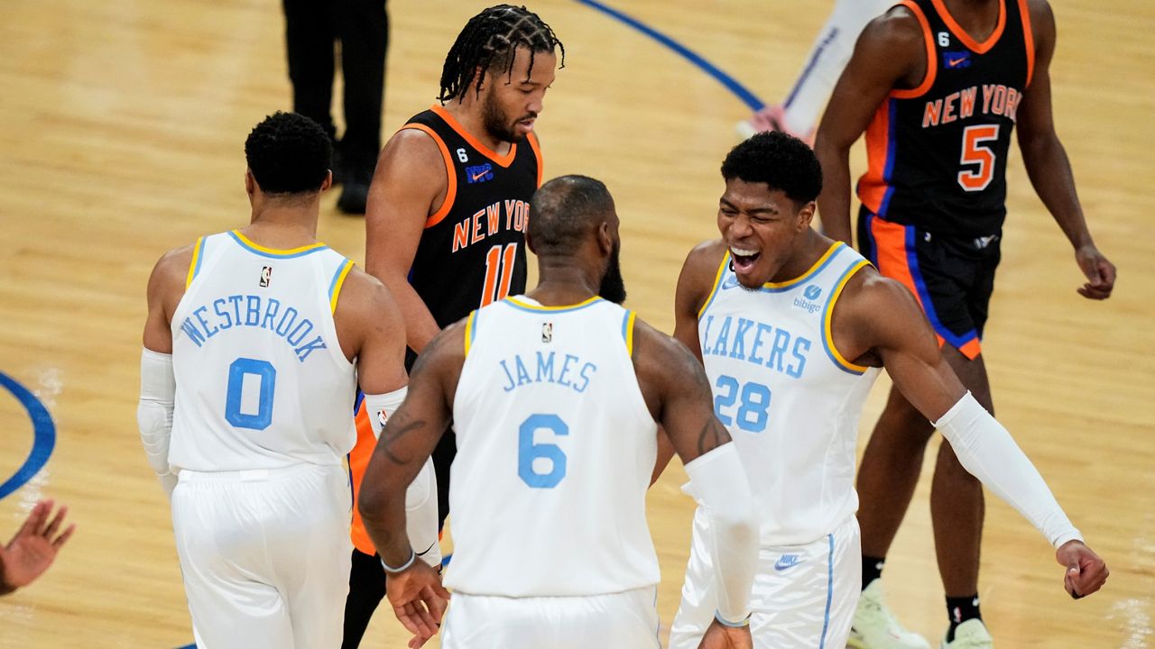 Los Angeles Lakers' Rui Hachimura (28), of Japan, celebrates with LeBron James (6) and Russell Westbrook (0) as New York Knicks' Jalen Brunson walks past them after James scored during the second half of an NBA basketball game Tuesday, Jan. 31, 2023, in New York. The Lakers won 129-123 in overtime. (AP Photo/Frank Franklin II)