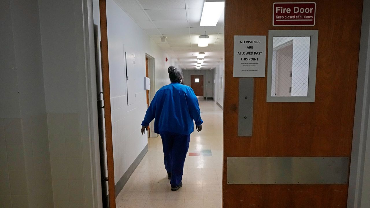 In this April 9, 2019 photo, Dr. Megan Mahoney, center, examines patient Consuelo Castaneda, right, as medical scribe Anu Tirapasur documents the visit at the Stanford Family Medicine office in Stanford, Calif. Some patients are dropping their family doctor as other choices like telemedicine, walk-in clinics and free health screenings at work grow. But health care experts say the fragmented nature of care is precisely why people still need someone who looks out for their overall health.