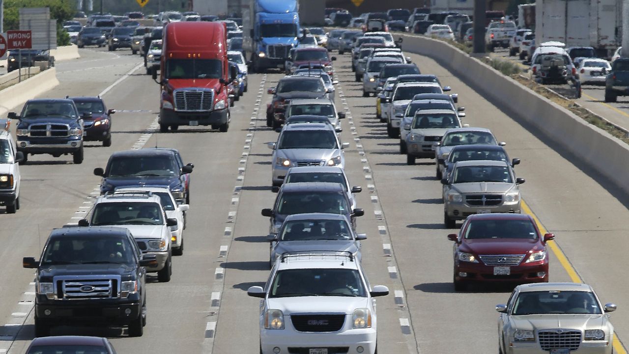 People drive their vehicles during rush hour in Dallas on July 1, 2016. (AP Photo/LM Otero, File)