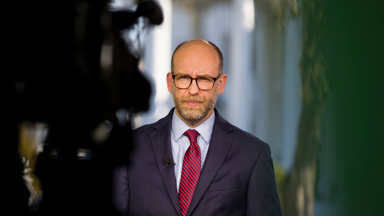 Acting director of Office of Management and Budget Russ Vought listens during a television interview at the White House, Monday, Oct. 21, 2019, in Washington. (AP Photo/Alex Brandon)