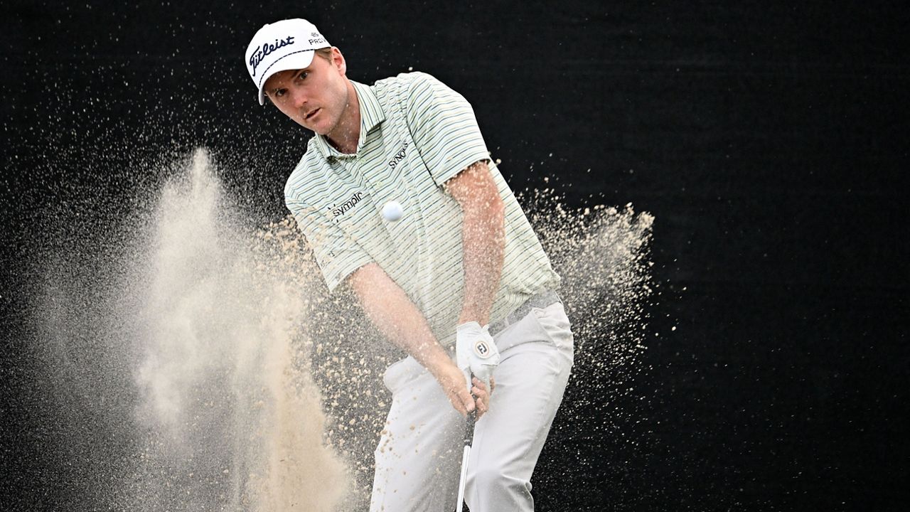 Russell Henley hits out of a bunker onto the 14th green during the third round of the Arnold Palmer Invitational at Bay Hill golf tournament, Saturday, March 8, 2025, in Orlando, Fla. (AP Photo/Phelan M. Ebenhack)