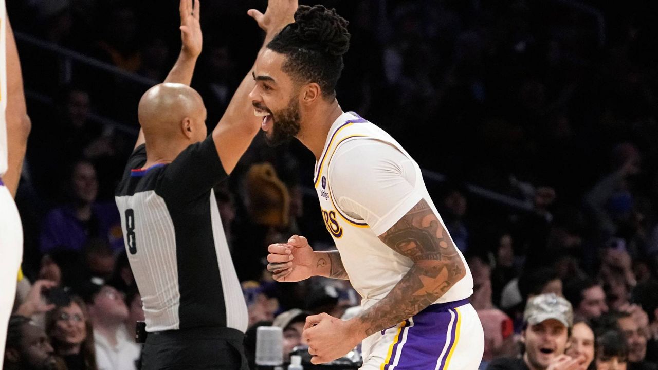 Los Angeles Lakers guard D'Angelo Russell celebrates after hitting a three-point shot during the second half of an NBA basketball game against the Portland Trail Blazers Sunday in LA. (AP Photo/Mark J. Terrill)
