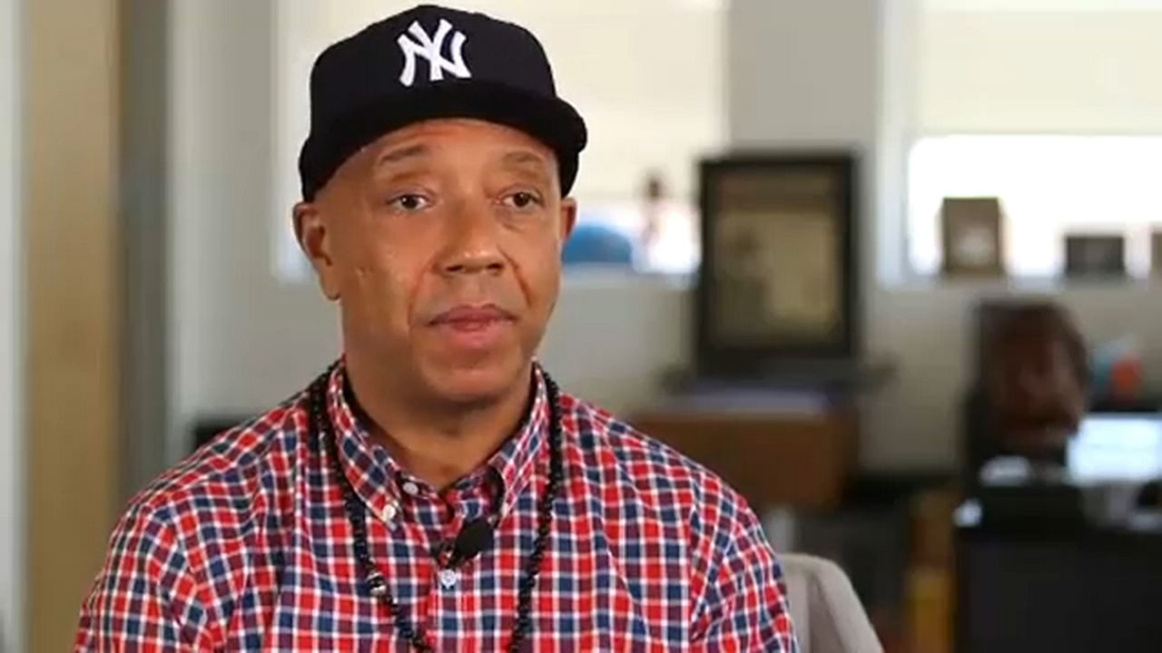 music mogul Russell Simmons wearing a Yankees hat