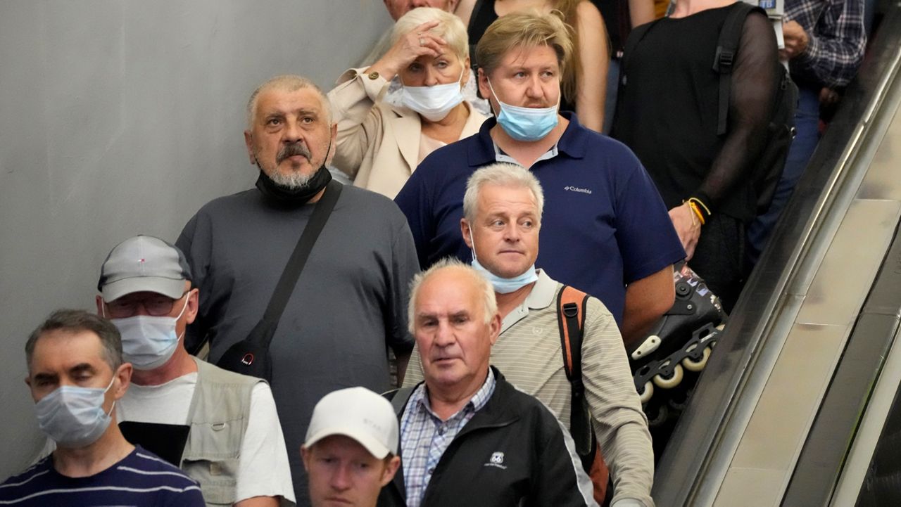 People are seen riding an escalator in St. Petersburg, Russia.  (AP/Dmitri Lovetsky)