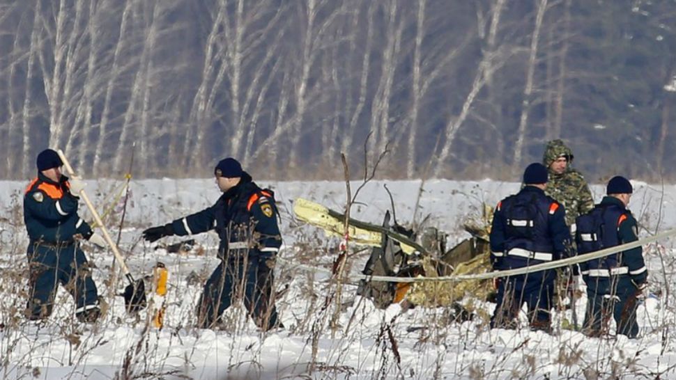 Personnel work at the scene of an AN-148 plane crash in Stepanovskoye village. A Russian passenger plane was carrying 71 people crashed Sunday near Moscow, killing everyone aboard shortly after the jet took off from one the city's airports. (AP Photo/Alexander Zemlianichenko)