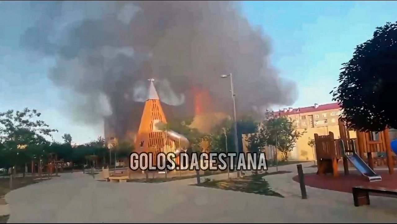 In this photo made from video released by Golos Dagestana, smoke rises following an attack at a synagogue in Derbent of the Republic of Dagestan, Russia, Sunday, June 23, 2024. (Golos Dagestana via AP)