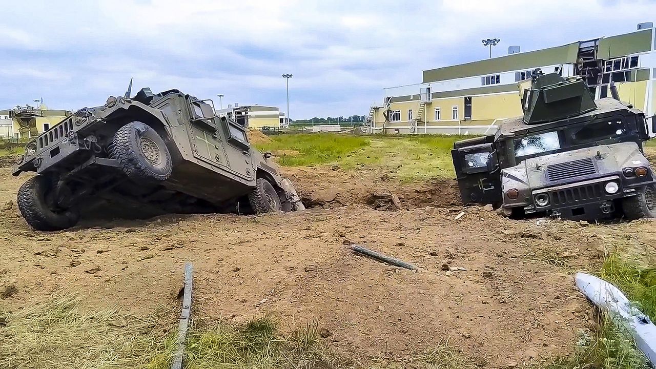 In this image taken from video released by Russian Defense Ministry Press Service, damaged armored military vehicles are seen Tuesday after fighting in Russia's western Belgorod region. (Russian Defense Ministry Press Service via AP)