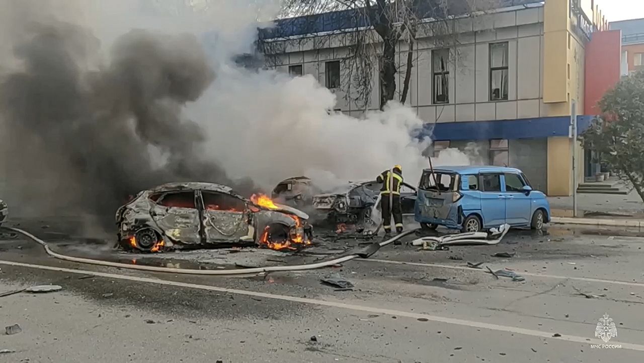 Firefighters extinguish burning cars after shelling in Belgorod, Russia, last weekend. (Russia Emergency Situations Ministry Telegram channel via AP)