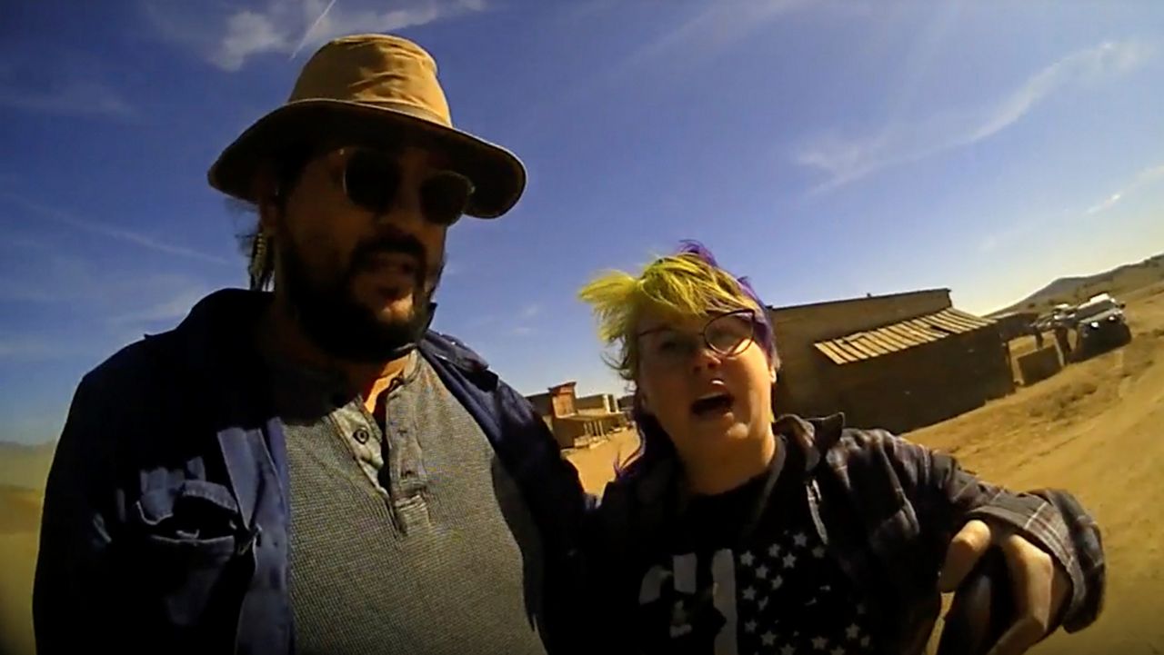 In this screen grab from lapel camera video provided by the Santa Fe County Sheriff's Office, movie set armorer Hannah Gutierrez-Reed, right, speaks with a sheriff’s deputy as a colleague stands next to her on the set of the western move “Rust,” shortly after the fatal shooting of cinematographer Halyna Hutchins by Alec Baldwin during a rehearsal, Oct. 21, 2021, in New Mexico. A judge will consider allegations of due process violations in the prosecution of Gutierrez-Reed, who is accused of involuntary manslaughter and evidence tampering in Hutchins' death, at an online court hearing scheduled Tuesday, Aug. 1, 2023. Charges against Baldwin in connection with the shooting were dismissed in April. (Santa Fe County Sheriff's Office via AP)