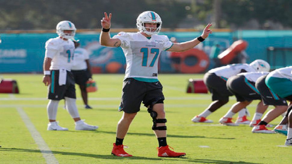 Miami Dolphins quarterback Ryan Tannehill (17) calls a play at the NFL football team's training camp, Thursday, July 26, 2018, in Davie, Fla. (AP Photo/Lynne Sladky)